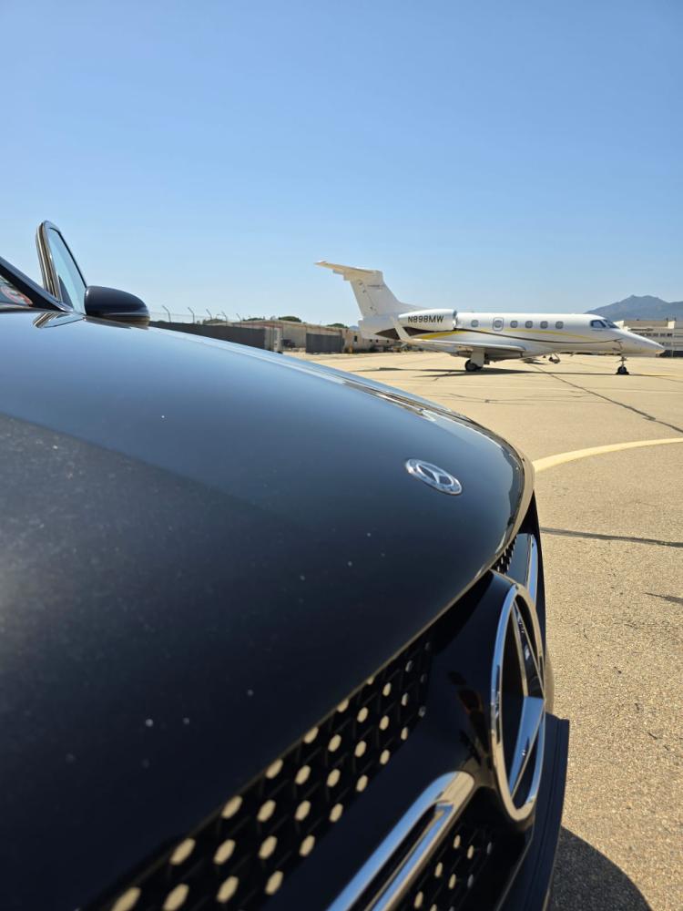 Private Mercedes VTC vehicle parked on the tarmac at Bastia Poretta airport
